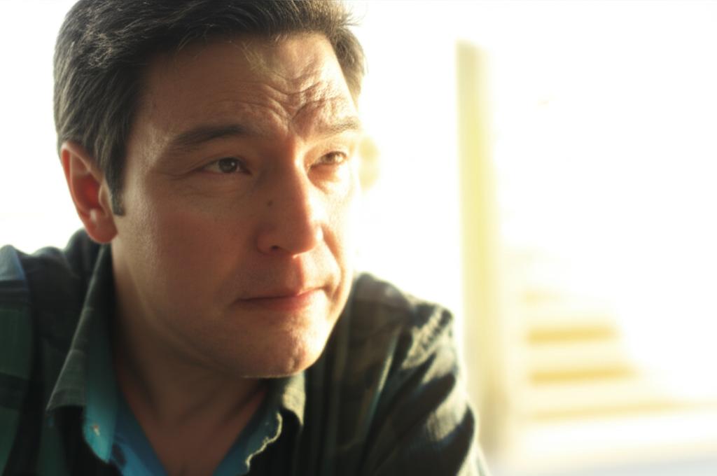 man looking concerned in morning light, thoughtful expression, soft focus